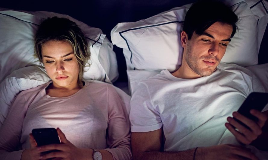 Scrolling in your cellphone in mattress at night time does ‘harm’ to your relationship, consultants say
